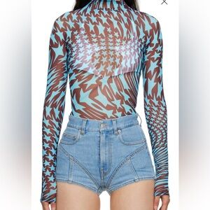 MUGLER
Blue & Brown Star Turtleneck.